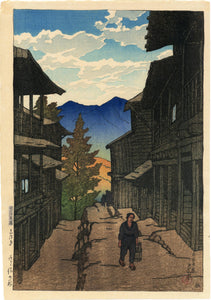 Hasui: Autumn in the Arayu Spa, Shiobara. Note the contrasting textures of sky, tree and buildings in this pre-earthquake design.